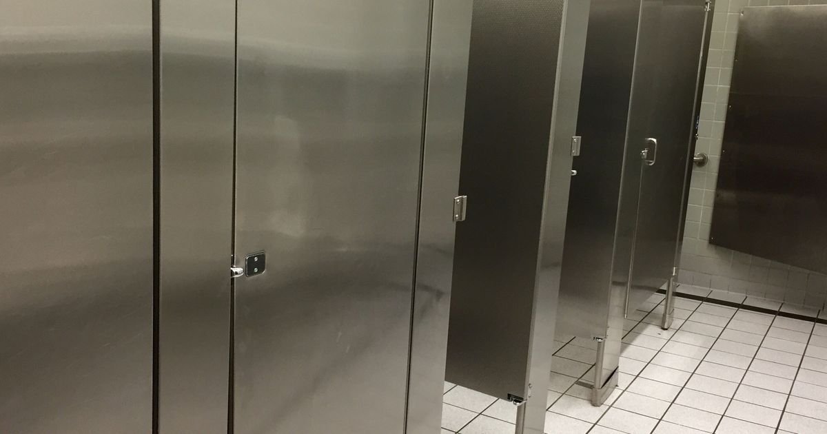 Why You Should Not Stay In A Bathroom Stall After Flushing