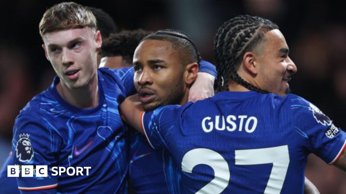 Chelsea players celebrate scoring a goal