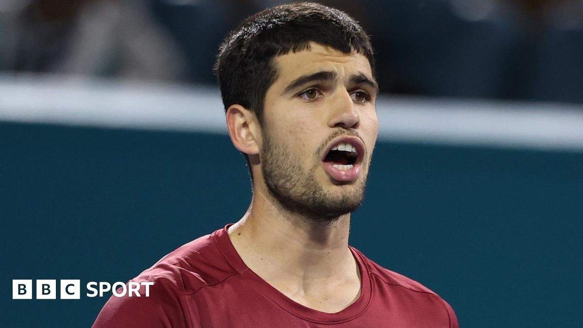 Carlos Alcaraz reacts to a missed point during his Miami Open second-round match against David Goffin