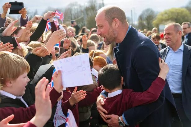 Prince William jokes about breaking world record as he's mobbed by schoolkids