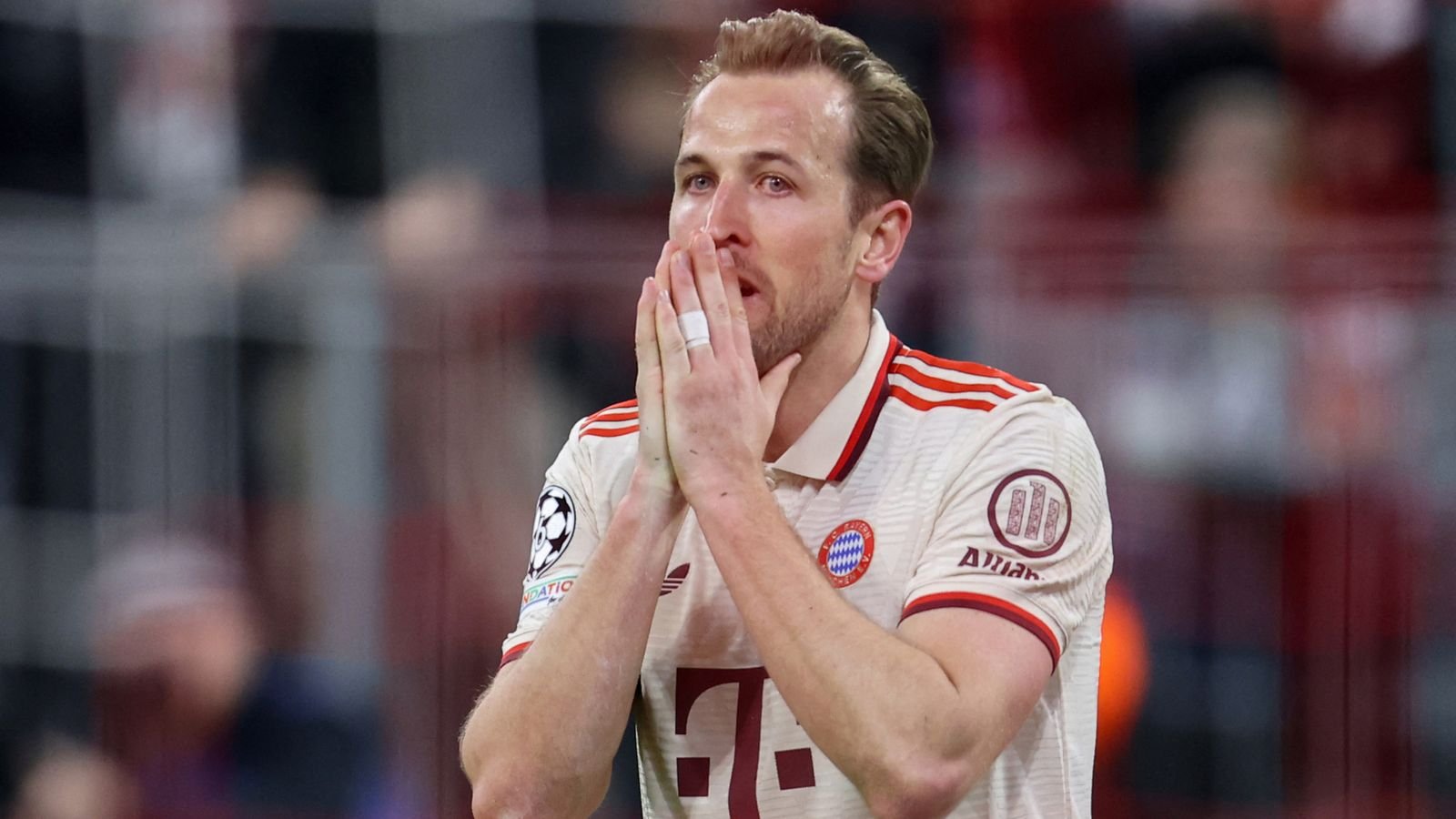 Harry Kane reacts after his shot came off the post during the UEFA Champions League first leg quarter-final football match between FC Bayern Munich and Inter Milan in Munich, southern Germany, on April 8, 2025.