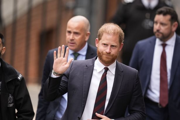 Prince Harry flashes a smirk at court as battle over taxpayer funded security continues