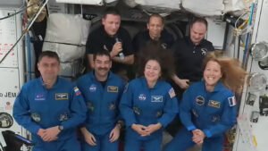 Expedition 74 welcomes NASA's SpaceX Crew-12 members aboard the International Space Station. In the front from left are, Andrey Fedyaev of Roscosmos, Jack hatchway and Jessica Meir, both from NASA, and Sophie Adenot from ESA (European Space Agency). In the back are, Sergey Kud-Sverchkov of Roscosmos, Chris Williams of NASA, and Sergei Mikaev of Roscosmos.