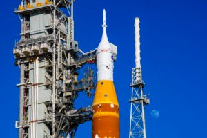 The Moon is seen behind the SLS (Space Launch System) and Orion spacecraft, atop the mobile launcher on January 28, 2026. The rocket is currently at Launch Pad 39B at NASA’s Kennedy Space Center in Florida, as teams are preparing for a wet dress rehearsal to practice timelines and procedures for the launch of Artemis II. 508 Description:The Moon is seen shining over the SLS (Space Launch System) and Orion spacecraft, atop the mobile launcher on January 29, 2026. The rocket is currently at Launch Pad 39B at NASA’s Kennedy Space Center in Florida, as teams are preparing for a wet dress rehearsal to practice timelines and procedures for the launch of Artemis II.