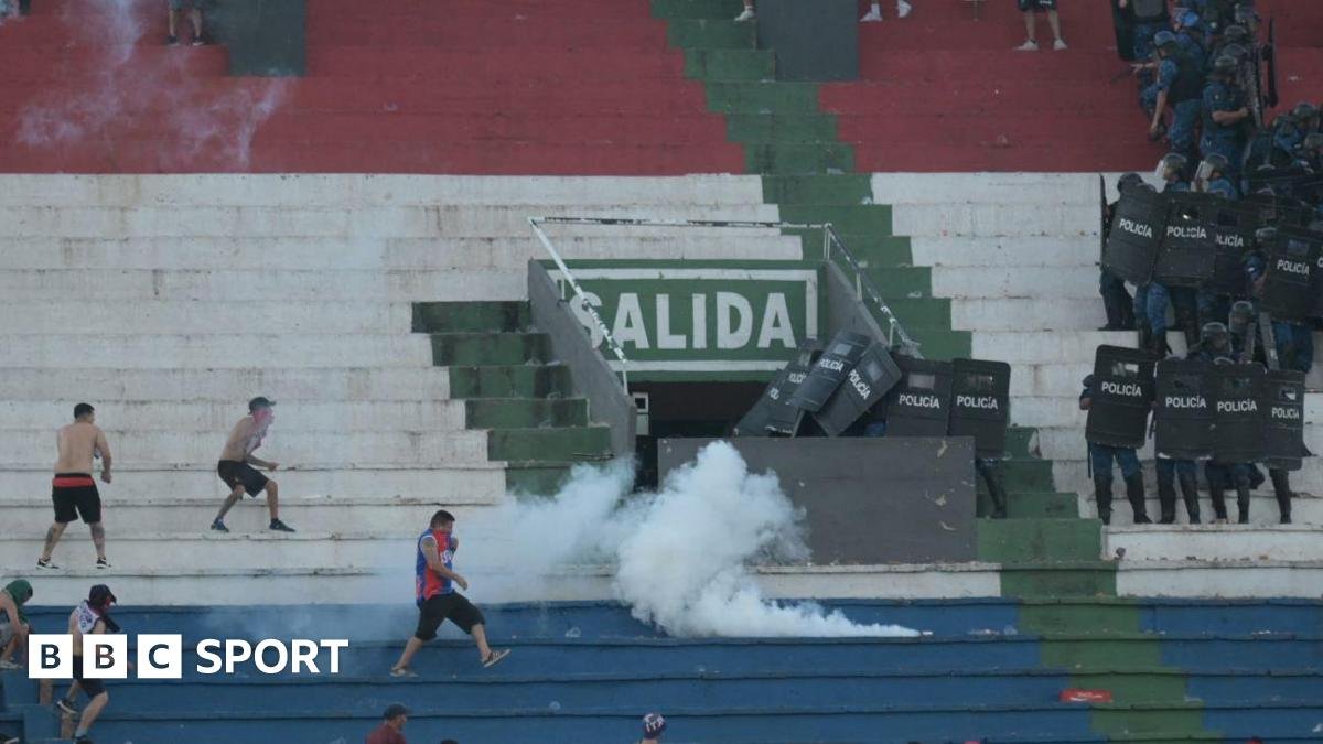 Police fire tear gas in an attempt to quell trouble during a game between Olimpia and Cerro Porteno in the Paraguay captial Asuncion.