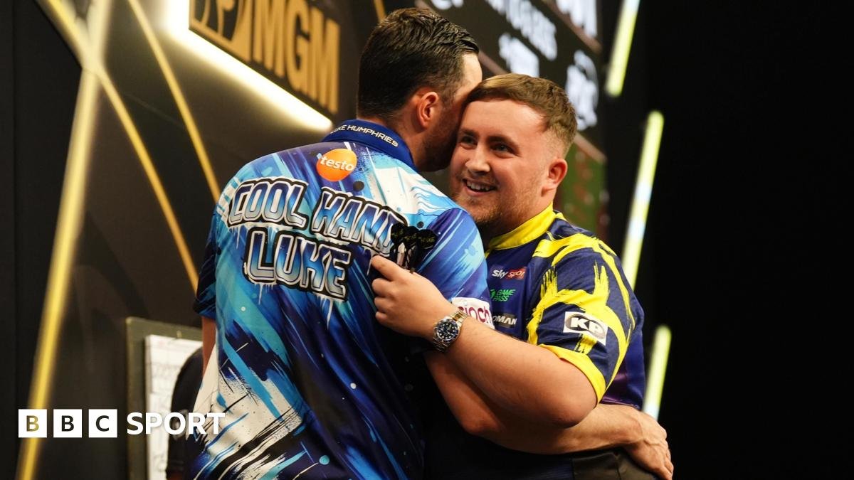 Luke Littler (right) embraces Luke Humphries after victory in the final on night thirteen of the BetMGM Premier League 2026 at P&J Live, Aberdeen.