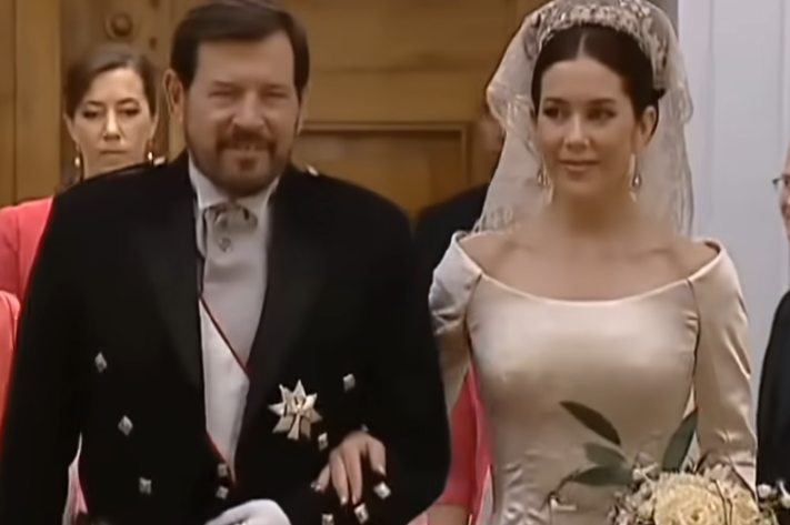 Queen Mary of Denmark walks into Copenhagen Cathedral with her father, John Donaldson