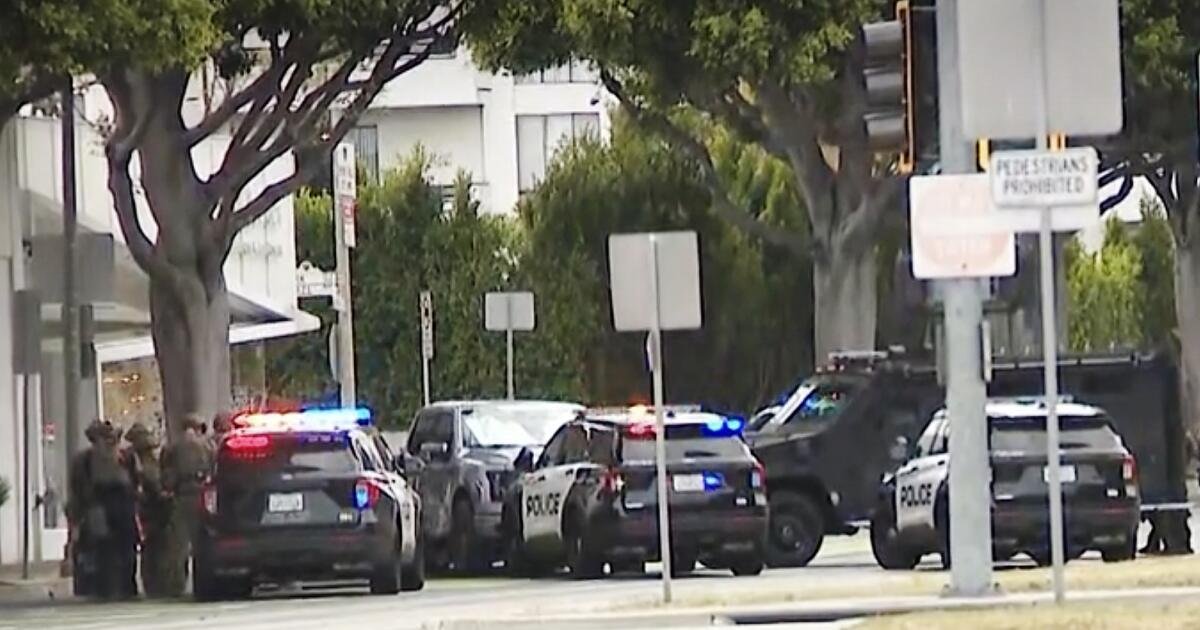 Armed man barricaded inside a vehicle after Beverly Hills police pursuit; hostage released
