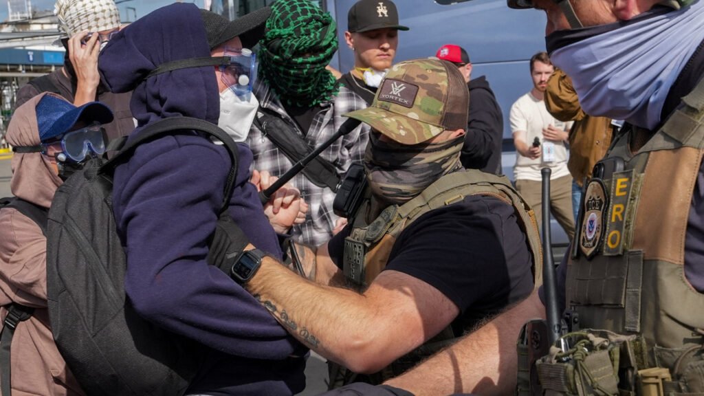 ICE agents use pepper spray on protesters outside detention centre | Police