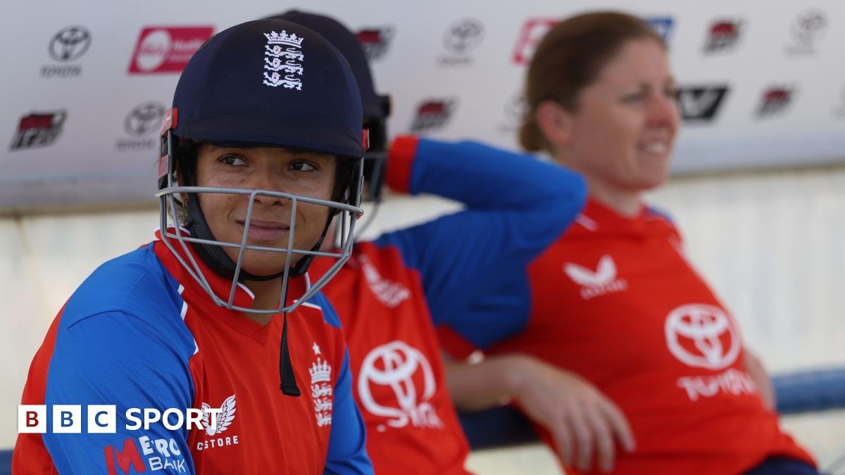 Sophia Dunkley looks on, with her helmet on, while waiting to bat