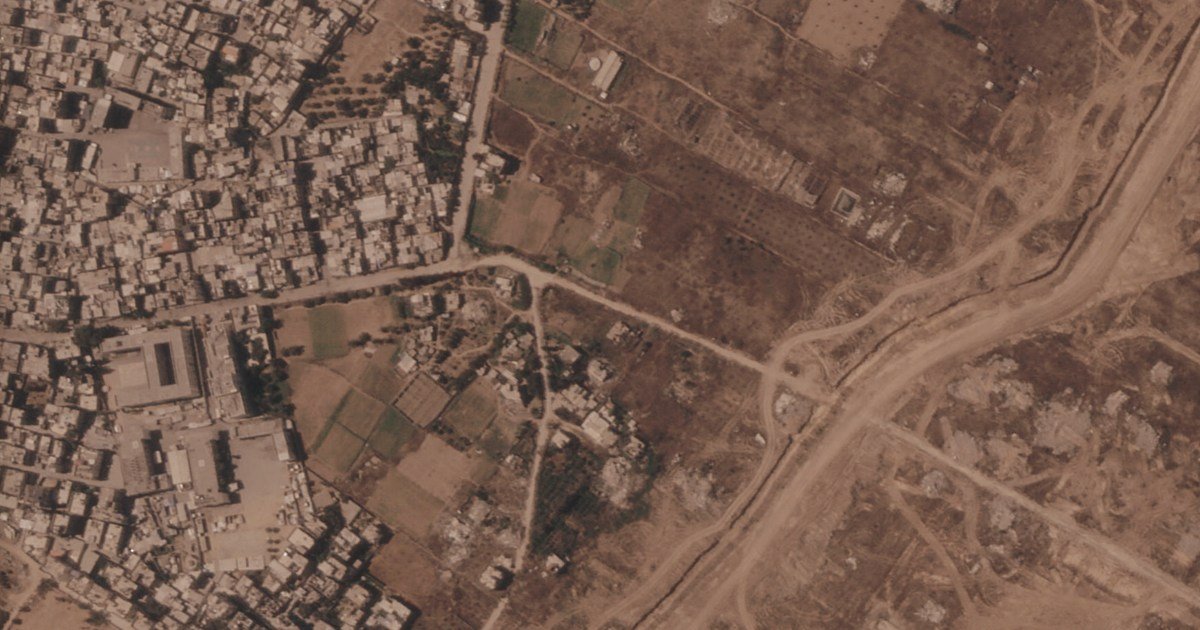 Israel is building a miles-long earthen barrier inside Gaza, entrenching its division
