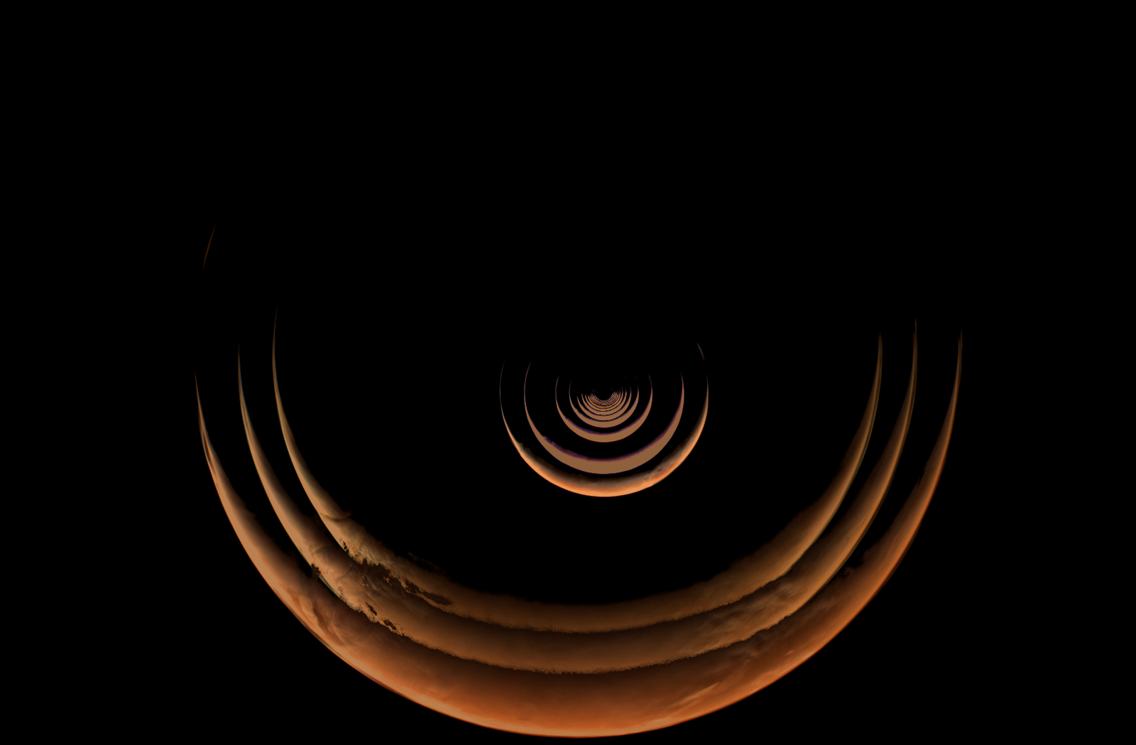 Mars, as seen by NASA's Psyche spacecraft as it approached the Red Planet. Mars appears as a thin, concentric crescents in this composite image.