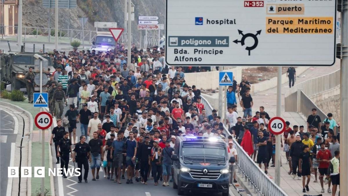 migrants swimming into Ceuta