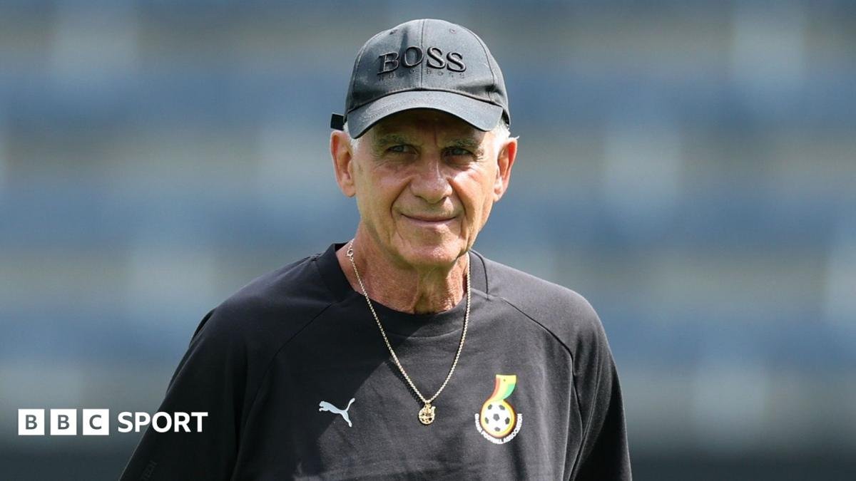 Carlos Queiroz is seen wearing a black Ghana training shirt, a necklace and a baseball cap with the word 'boss' on it