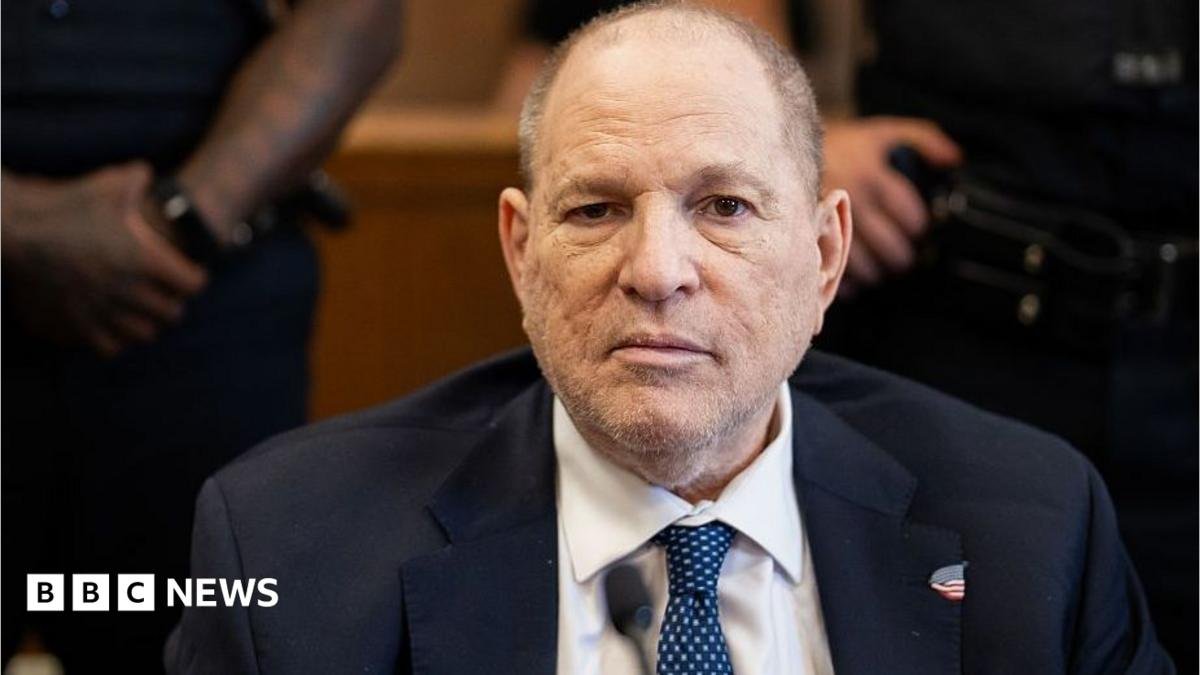 Harvey Weinstein in court in 2026. Hewears a suit with a blue spotted tie.