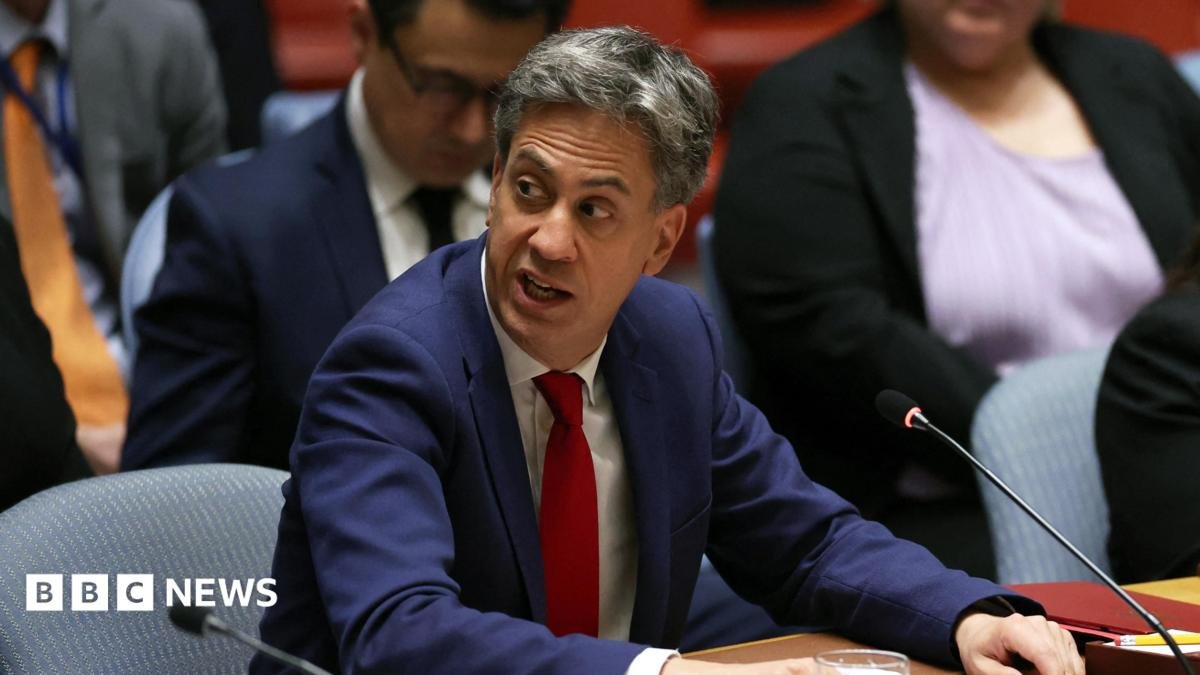 Britain's Foreign Secretary Ed Miliband attends a meeting of the United Nations Security Council, wearing a blue suit and red tie.