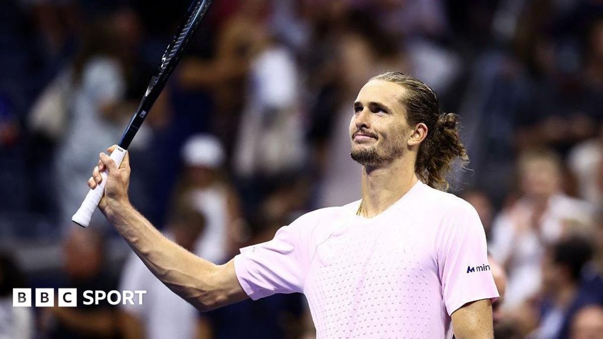 Alexander Zverev raises his racquet to the crowd