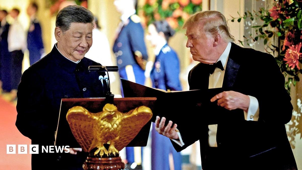 US President Donald Trump holds a binder as he stands next to Chinese President Xi Jinping before Xi delivers a speech during a state dinner at the White House in Washington, D.C., US, September 24, 2026.