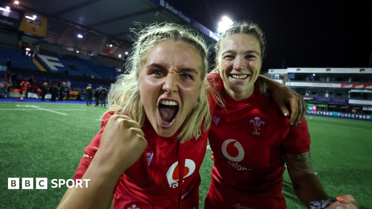 Wales co-captain Alex Callender celebrates victory with Keira Bevan